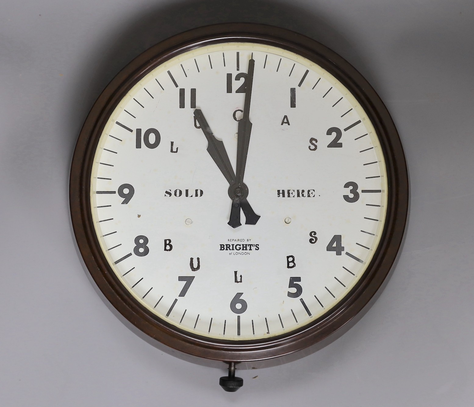 A Bakelite Lucas Bulbs advertising wall clock